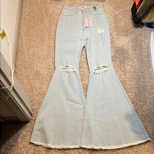 Chic Light Blue Flare Jeans with Distressed Details